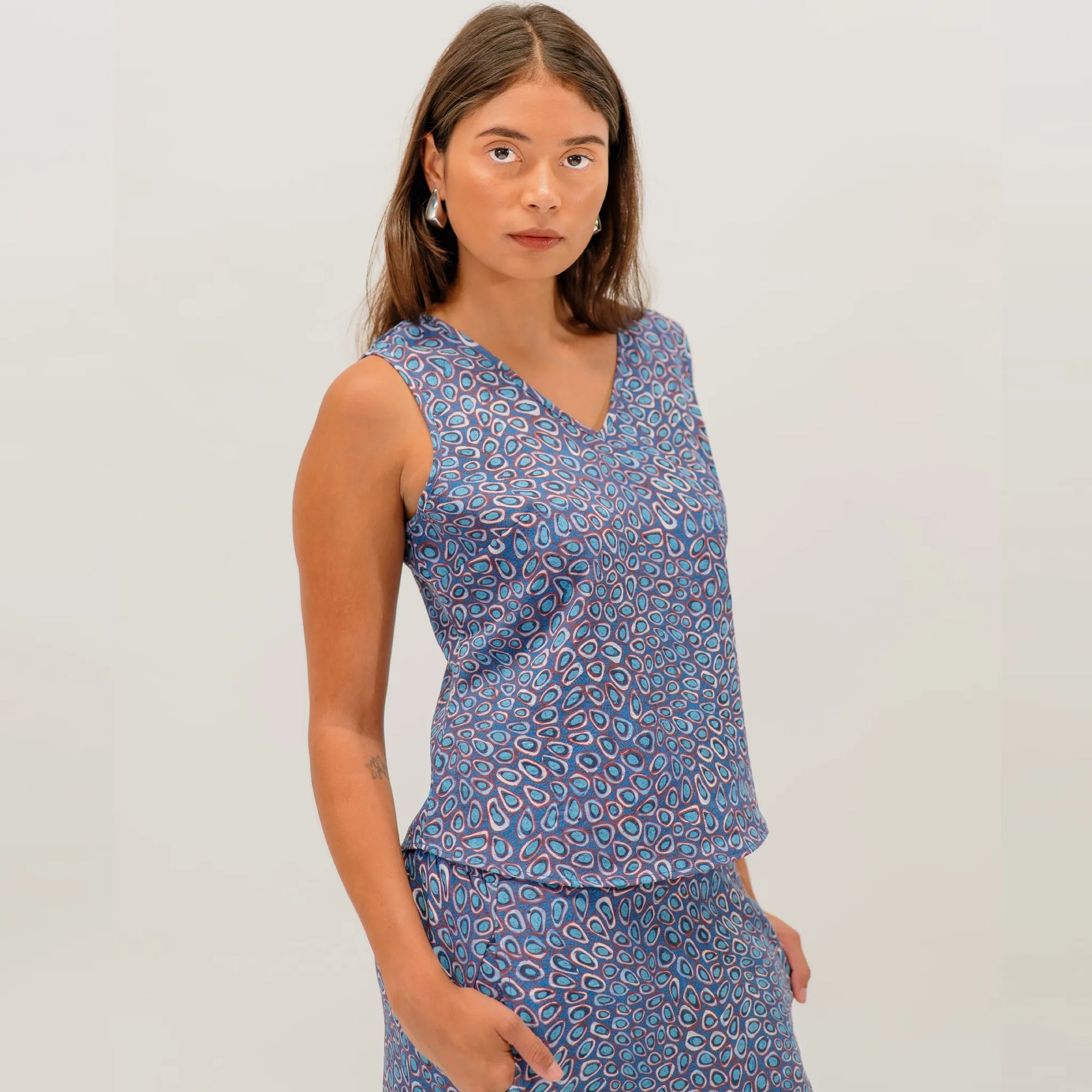 Women's Wildflowers in the Pilbara Tank Top showcasing authentic Australian Indigenous artwork by Carol Martin.